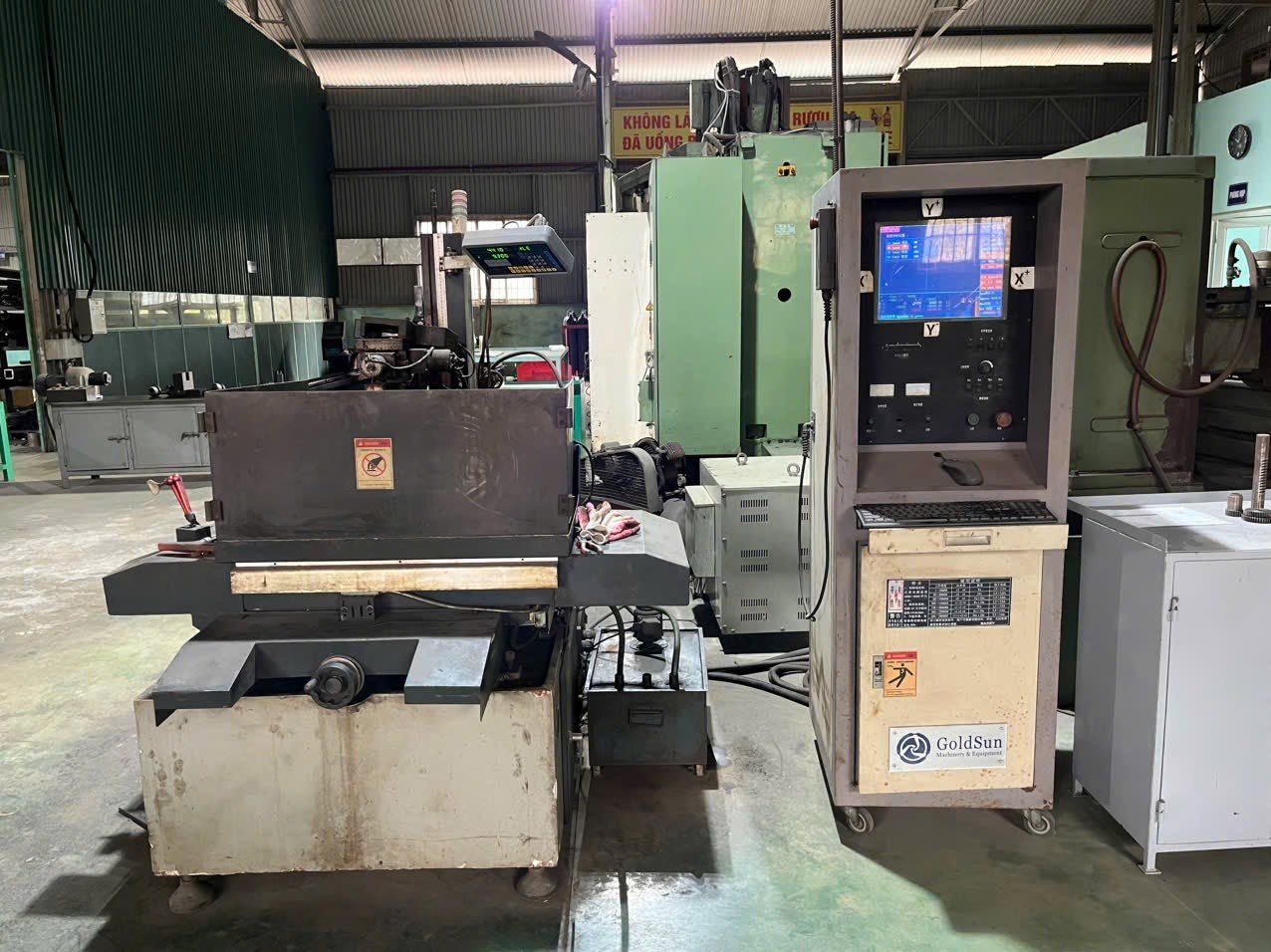 A wire-cutting machine and its control cabinet.