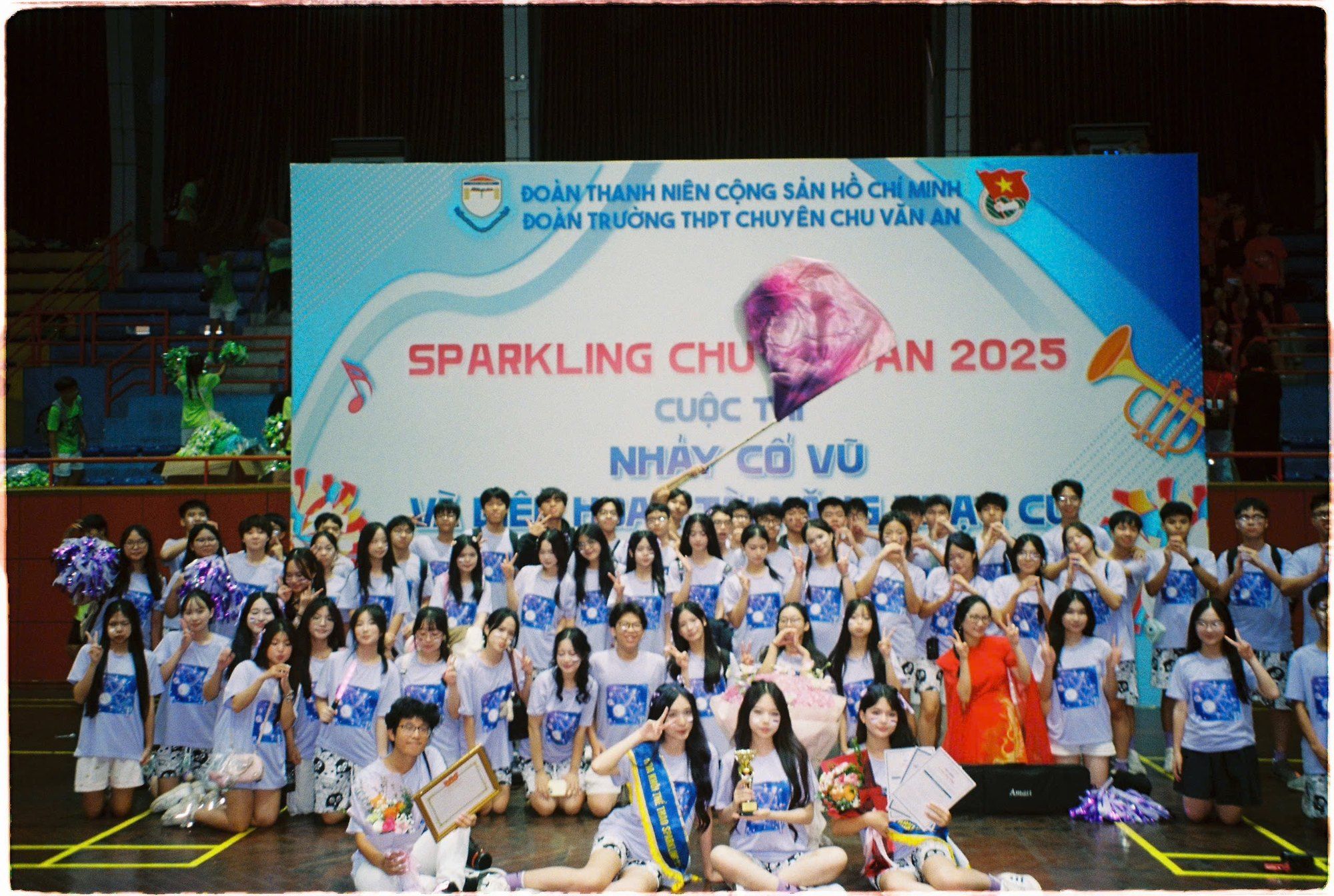Cheerdance participants posing in front of the Sparkling Chu Van An 2025 banner.